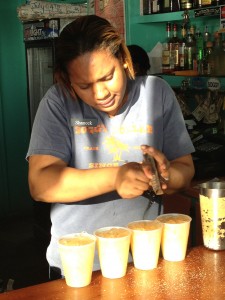 Our bartender adds freshly ground nutmeg to our Painkillers