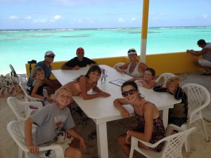 Toes in the sand, beach only feet away, and a yummy fish and lobster lunch on the way...