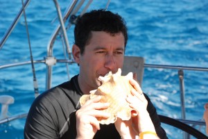 Eric blows the conch like a pro.  I guessed his former trombone-player embouchere.