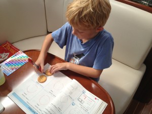 working on math.  yes, he got to eat the Ritz after tracing them!