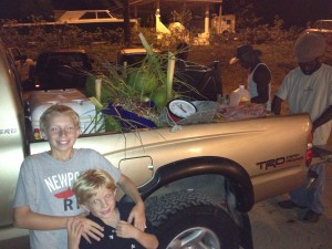 The kids make friends with some locals outside the bar, who sell lobster and coconuts from their pickup.  They were all BFFs by the end of the night.  That is one BIG lobster!