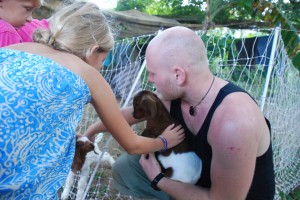 petting the baby goats at the farm