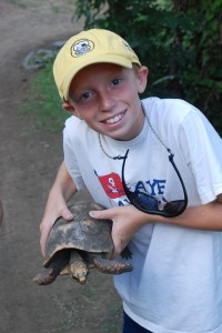 Bryson gets to hold  a turtle.