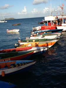 the main harbor dock, lined with big and little local fishing boats