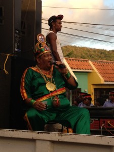 A calypso singer riding on a float