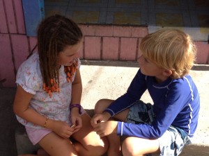 Olivia and Porter in deep conversation on the side of the road