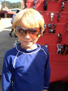 trying on shades at a roadside vendor