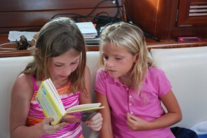 Reese and Kelli back at the boat, reading Nancy Drew together.