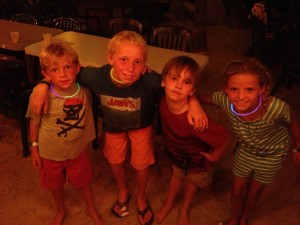 The kids barely stay awake after a long day of sun and surf.  Liam is sleeping on a chair at this point of the night!