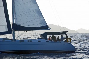 Lana, Dave, and a whole mess of kids sailing for Norman Island as the day wanes.